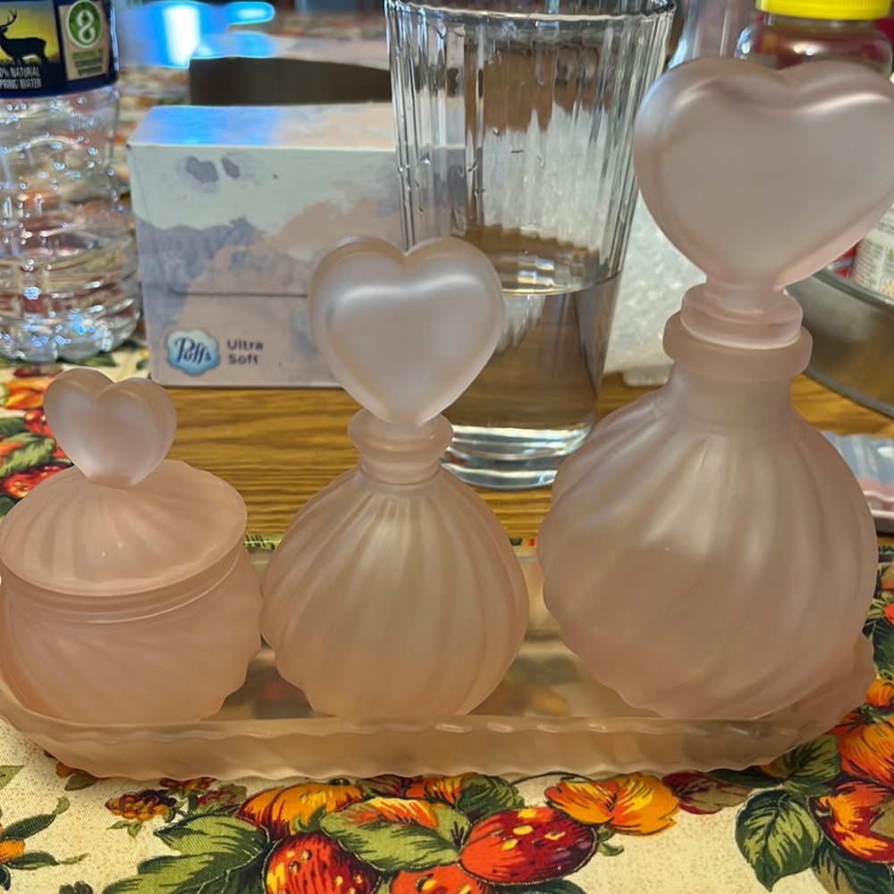 3 gorgeous satin pink swirl perfume bottles with a tray
